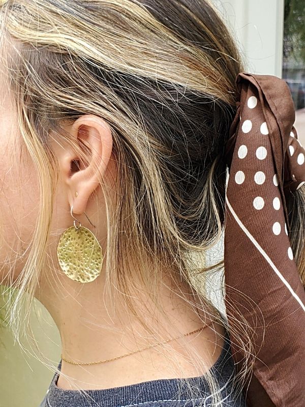 wearing pony tail scarf & big disc earrings
